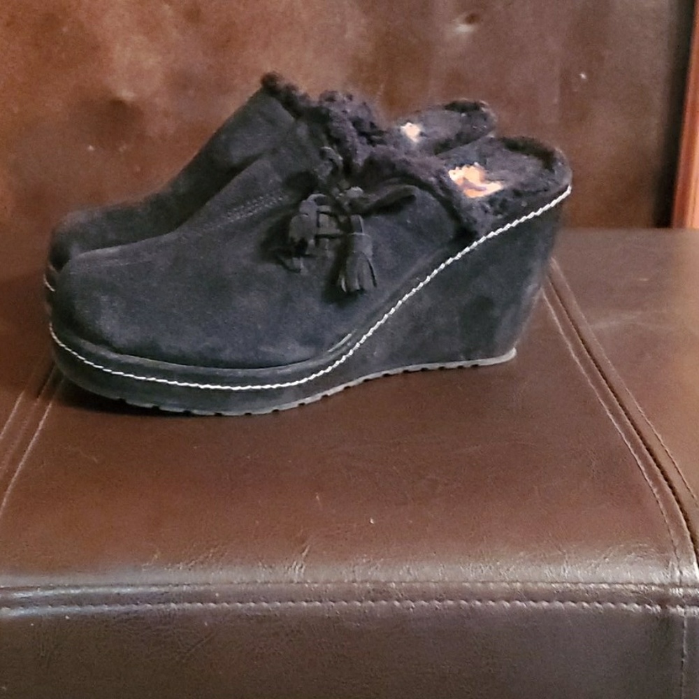 Black fuzzy wedge clogs